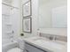 Bright bathroom featuring a tub, vanity with granite countertops, and botanical wall art at 186 Amberwood Way, Umatilla, FL 32784