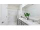 Modern bathroom with double sinks, a shower, and stylish fixtures for a luxurious experience at 186 Amberwood Way, Umatilla, FL 32784