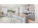 Spacious kitchen with island seating that opens to the dining and living areas at 186 Amberwood Way, Umatilla, FL 32784