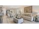 Bright, open-concept living room and dining area with stylish furnishings and decor for modern living at 186 Amberwood Way, Umatilla, FL 32784