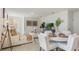 Open-concept living space with stylish furnishings and a dining area featuring lots of light at 186 Amberwood Way, Umatilla, FL 32784