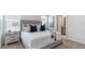 Comfortable main bedroom featuring a plush bed, stylish nightstands, and ample natural light at 186 Amberwood Way, Umatilla, FL 32784