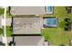 Aerial view of homes with screened-in pools, offering a bird's-eye perspective of the neighborhood layout at 1925 Estuary Ln, Kissimmee, FL 34747