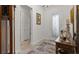 Bright foyer showcasing hardwood floors and a decorative table, leading to other areas of the home at 1925 Estuary Ln, Kissimmee, FL 34747