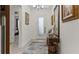 Bright foyer featuring a decorative table, hardwood floors, and an inviting entrance at 1925 Estuary Ln, Kissimmee, FL 34747