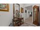 Welcoming foyer with stylish decor, hardwood floors, and an inviting view into the home's living spaces at 1925 Estuary Ln, Kissimmee, FL 34747