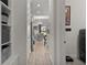 The hallway features a laundry area that leads to the dining room and kitchen at 1925 Estuary Ln, Kissimmee, FL 34747