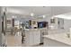 The kitchen flows into the dining and living areas, with slider access to outdoor views at 1925 Estuary Ln, Kissimmee, FL 34747