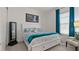 Charming main bedroom boasts a queen-sized bed with an ensuite bath and a lovely window view at 1925 Estuary Ln, Kissimmee, FL 34747