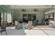 The covered patio has an outdoor kitchen, wood burning fireplace, and comfortable seating at 1925 Estuary Ln, Kissimmee, FL 34747
