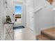 Entryway showing tile flooring, neutral walls, front door and stairway to the second floor at 2076 Monteverde Ave, Davenport, FL 33837