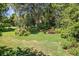 Lush backyard with mature trees and greenery that provides privacy at 210 Lonesome Pine Dr, Longwood, FL 32779