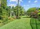 Manicured backyard featuring beautiful landscaping and a well maintained lawn at 210 Lonesome Pine Dr, Longwood, FL 32779