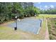 Aerial view of a basketball court and a fenced soccer field surrounded by trees in a neighborhood park at 210 Lonesome Pine Dr, Longwood, FL 32779