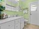 Bright bathroom with white vanity, marble countertops and tile floor at 210 Lonesome Pine Dr, Longwood, FL 32779