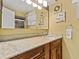 Bathroom featuring granite counters, a large mirror, and a shower at 210 Lonesome Pine Dr, Longwood, FL 32779