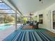 Screened lanai featuring a seating area and views of the pool at 210 Lonesome Pine Dr, Longwood, FL 32779