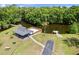 Aerial view of a pavilion near the water with walkways, picnic tables, and boat docks at 210 Lonesome Pine Dr, Longwood, FL 32779