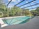 A lovely in-ground pool in a screened enclosure creates a relaxing outdoor space at 210 Lonesome Pine Dr, Longwood, FL 32779