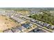 Aerial view of housing community boasting neatly lined streets, manicured lawns, and an organized layout at 2380 Kaley Ridge Rd, Clermont, FL 34715