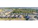 Aerial view of neighborhood with well-maintained homes, green lawns, and picturesque streets at 2380 Kaley Ridge Rd, Clermont, FL 34715