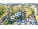 Aerial view of community amenities including resort style pool, playground, and other facilities at 2380 Kaley Ridge Rd, Clermont, FL 34715