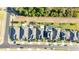 Overhead picture of neighborhood houses with large roofs, solar panels, and well-kept yards at 2380 Kaley Ridge Rd, Clermont, FL 34715