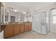 Bathroom has granite countertops, a dual sink vanity, and a glass-enclosed shower at 2380 Kaley Ridge Rd, Clermont, FL 34715