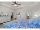 Beautiful bedroom showcasing a white bed frame, dresser, and ensuite bathroom for convenience at 2380 Kaley Ridge Rd, Clermont, FL 34715