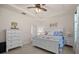 Lovely bedroom has a white bed frame, a dresser, and an ensuite, creating a relaxing retreat at 2380 Kaley Ridge Rd, Clermont, FL 34715