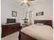 The bedroom is furnished with hardwood furniture, has natural light, and is ideal for relaxation at 2380 Kaley Ridge Rd, Clermont, FL 34715
