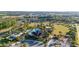 Bird's eye view of the community pool with umbrellas, lawn area, and a sand volleyball court at 2380 Kaley Ridge Rd, Clermont, FL 34715