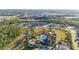 An aerial view of the community's swimming pool, recreation lawn, and surrounding new construction homes at 2380 Kaley Ridge Rd, Clermont, FL 34715