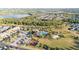 Aerial view of community with resort-style pool, clubhouse, and basketball court amenities at 2380 Kaley Ridge Rd, Clermont, FL 34715