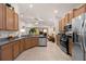Modern kitchen featuring granite countertops, stainless steel appliances, and ample cabinet space at 2380 Kaley Ridge Rd, Clermont, FL 34715