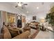 Cozy living room boasts plush sofas, a decorative rug, and natural light from sliding glass doors at 2380 Kaley Ridge Rd, Clermont, FL 34715
