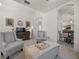 Bright living room featuring stylish armchairs, tile flooring, and an open layout at 2380 Kaley Ridge Rd, Clermont, FL 34715