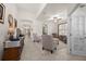Cozy living room showcasing tile floors, comfortable seating, and an open layout at 2380 Kaley Ridge Rd, Clermont, FL 34715
