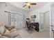 Inviting office with a comfortable sofa, desk, and plenty of natural light, creating a productive workspace at 2380 Kaley Ridge Rd, Clermont, FL 34715