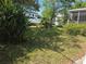 View of the side of a house with lush greenery and a view of a neighbor's house at 2507 Lafayette Ave, Winter Park, FL 32789