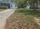 A single-story house with a driveway and an unkempt front yard needing landscaping at 2507 Lafayette Ave, Winter Park, FL 32789