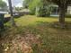 A residential home with an expansive lawn and trees creating natural shade and privacy at 2507 Lafayette Ave, Winter Park, FL 32789