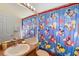 Bathroom featuring a Mickey Mouse shower curtain and a modern sink at 2535 Oneida Loop, Kissimmee, FL 34747