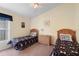 Bedroom featuring two twin beds with Minnie Mouse themed bedding and a dresser at 2535 Oneida Loop, Kissimmee, FL 34747