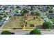 Aerial view of a community park featuring a playground, walking paths, and green spaces for recreation at 2535 Oneida Loop, Kissimmee, FL 34747
