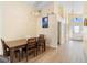Dining area showcasing wood flooring and entry to front foyer at 2535 Oneida Loop, Kissimmee, FL 34747