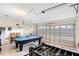Spacious garage with pool table, foosball table, and entertainment area at 2535 Oneida Loop, Kissimmee, FL 34747