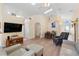 Bright, open-concept living space featuring wood floors, comfortable seating, and a dining area at 2535 Oneida Loop, Kissimmee, FL 34747