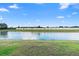 Expansive pond view offering a tranquil backdrop, enhancing the property's appeal and serenity at 2535 Oneida Loop, Kissimmee, FL 34747
