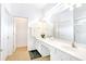 Bright bathroom with double vanity and clean, white finishes at 2618 Calistoga Ave, Kissimmee, FL 34741